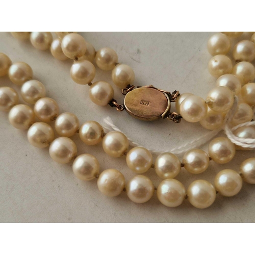 139 - A double strand of cultured pearls 14 inch