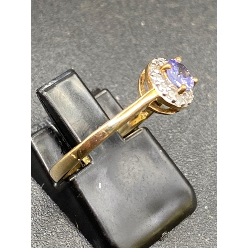 144 - Tanzanite and Diamond cluster ring size N One