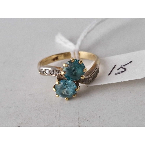 15 - A TWO STONE ZIRCON RING WITH DIAMOND SHOULDERS 18CT GOLD SIZE M 4.1 GMS