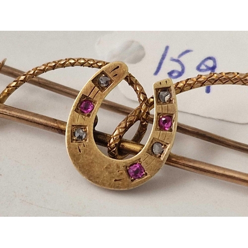 159 - A Victorian gold ruby and diamond riding crop and horse shoe brooch 9ct 6.4 gms