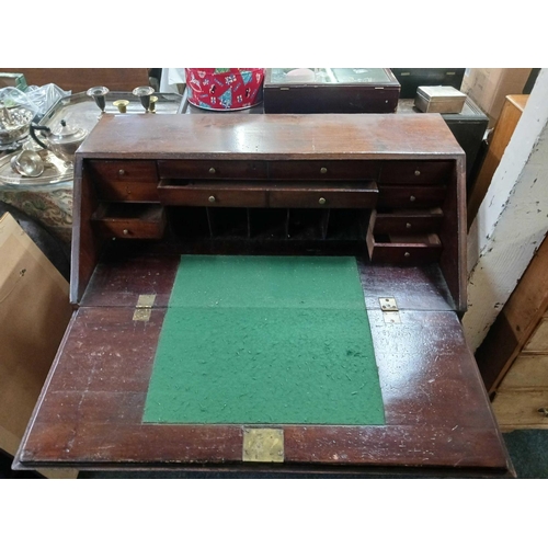 1717 - A George III mahogany bureau with fitted interior, drawers below, bracket feet