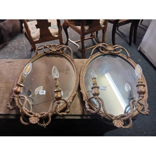 1718 - A pair of gilt framed mirrors each with two candle holders (now electric)