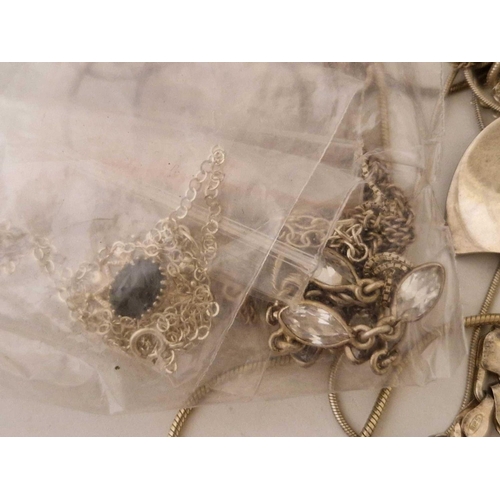 174 - A bag of assorted silver necklaces 190 gms