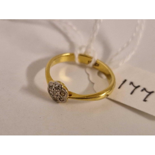 177 - A small diamond flower head ring 18ct gold size H 2 gms