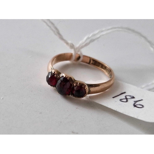 186 - A antique three stone garnet ring size N 2 gms