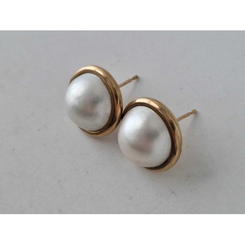 20 - A pair of large pearl set earrings 9ct 11.1 gms