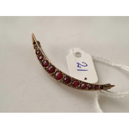 21 - A Edwardian crescent brooch with ruby and diamonds 9ct 3.1 gms