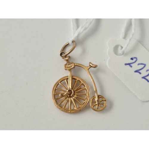 222 - A penny farthing articulated charm 9ct 1.8 gms