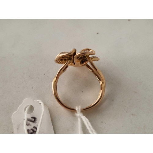 236 - A CONTEMPORARY DIAMOND FLOWER RING 18CT GOLD SIZE P 8.3 GMS