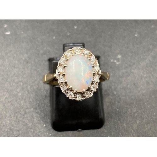 279 - Fine, Opal and Diamond clustering the opal with Green and Orange flashes Size K 9ct