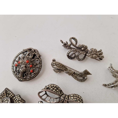 292 - Eight silver and marcasite brooches 68 gms