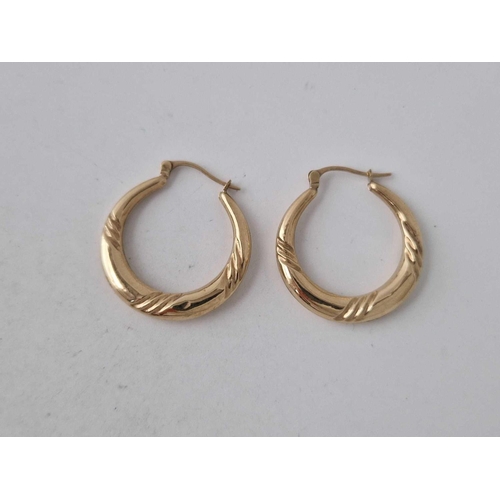 305 - A pair of hoop twist earrings 2.5 cm drop 9ct