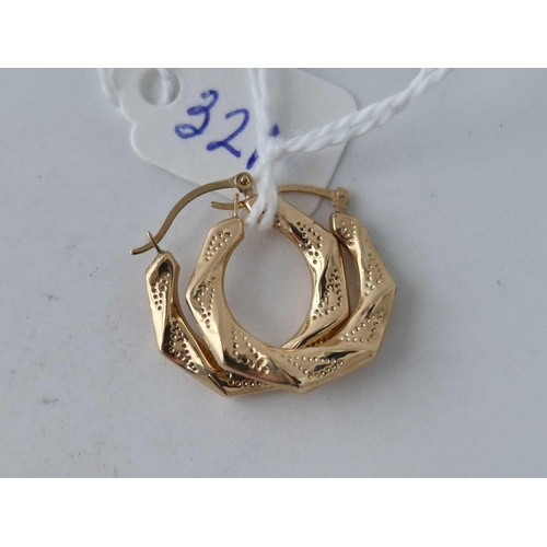 321 - A pair of fancy hoop earrings 9ct