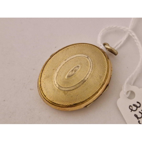 333 - A gilt oval double sided locket