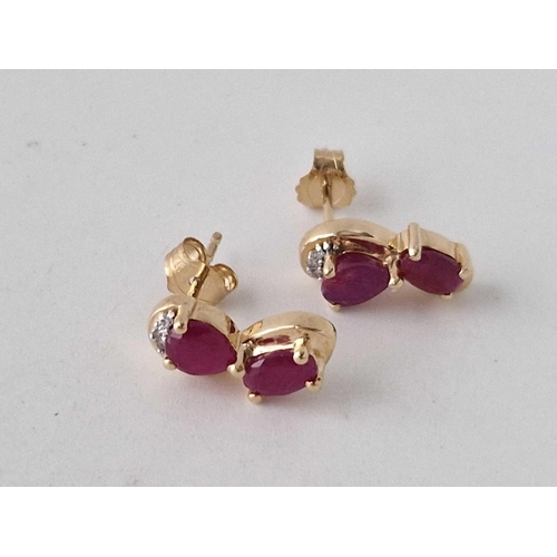 37 - A pair of ruby and diamond ear studs with COA 9ct 2.5 gms