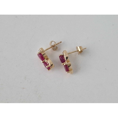 37 - A pair of ruby and diamond ear studs with COA 9ct 2.5 gms