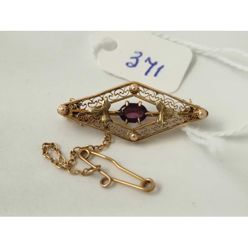 371 - A lozenge shaped brooch with filagree work and central amethyst 10ct gold 2.5 gms