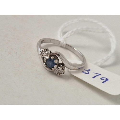 379 - A diamond and sapphire three stone ring 9ct size P