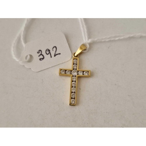 392 - A stone set cross 9ct 1.7 gms