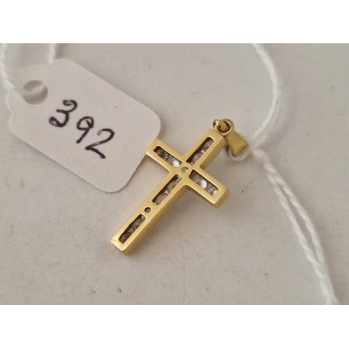 392 - A stone set cross 9ct 1.7 gms