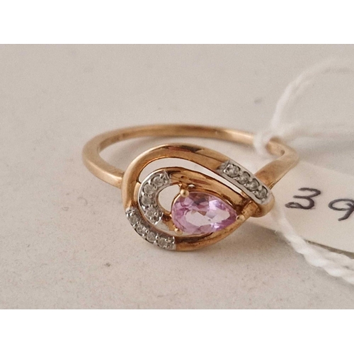 394 - A pink sapphire and diamond ring 10ct gold size Q 2.1 gms