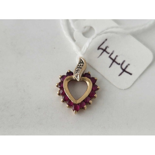 444 - A ruby and diamond heart pendant 14ct gold