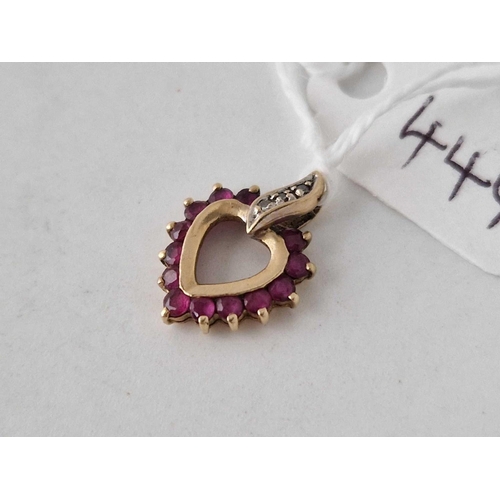 444 - A ruby and diamond heart pendant 14ct gold