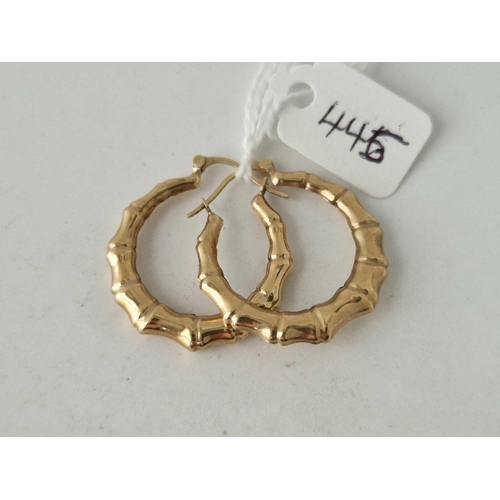 445 - A pair of fancy hoop earrings 9ct 1.6 gms