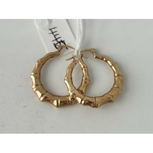 445 - A pair of fancy hoop earrings 9ct 1.6 gms