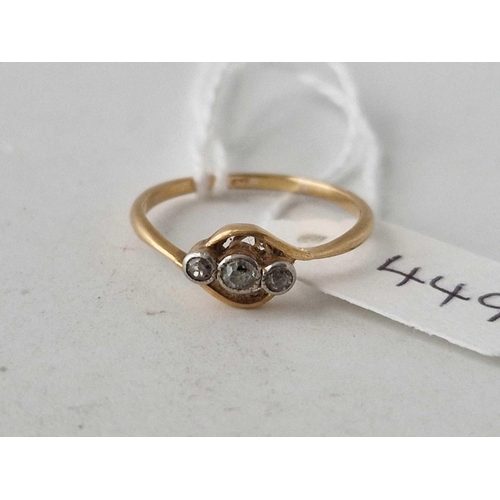 449 - A three stone diamond ring 18ct gold size N 1.7 gms