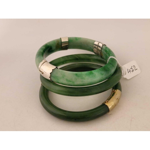 452 - Two hinged and one other jadeite bangles