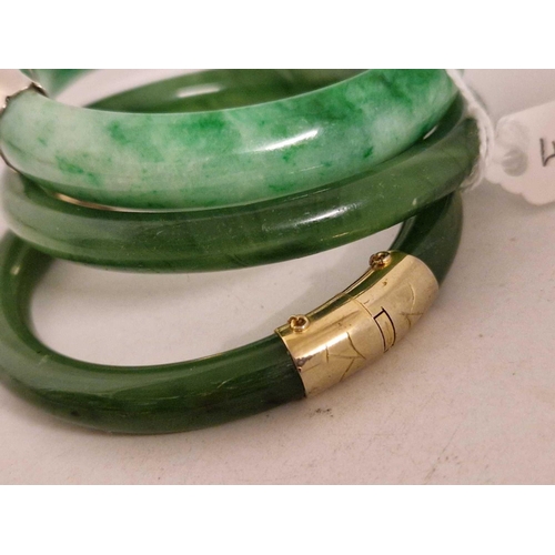 452 - Two hinged and one other jadeite bangles