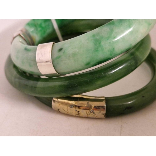 452 - Two hinged and one other jadeite bangles