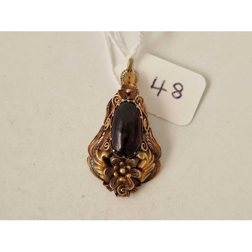 48 - Antique Victorian cabochon garnet set drop pendant in a 15ct cannetille mount