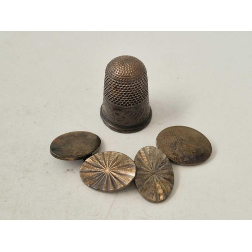 491 - A silver thimble and a pair of cufflinks