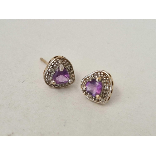 494 - A pair of small amethyst and diamond heart earrings and pendant in gold 1.8 gms