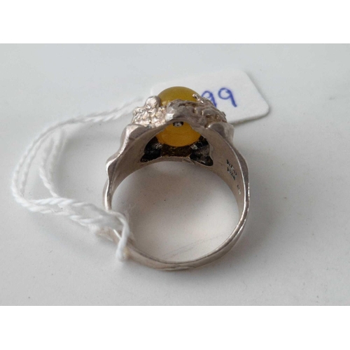 499 - A silver dragon ring with polished stone size V