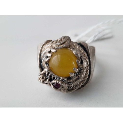 499 - A silver dragon ring with polished stone size V