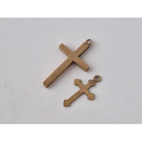 528 - Two 9ct crosses 1.5 gms