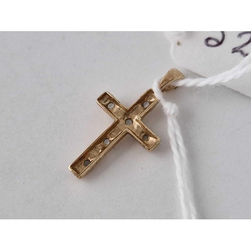 529 - A cross pendant with blue stones 9ct