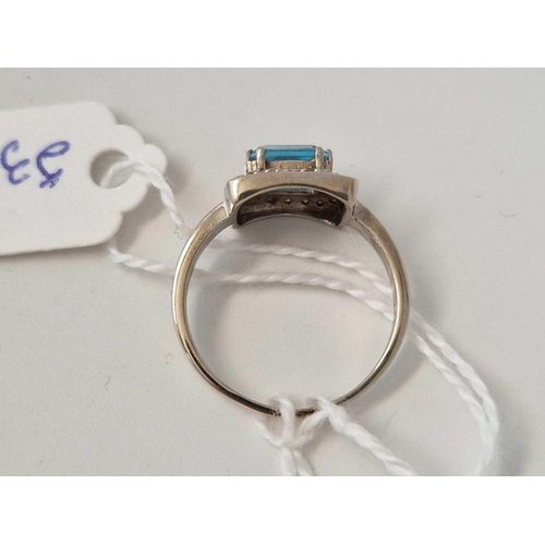 533 - A white gold blue topaz and diamond ring 9ct size Q 2.9 gms