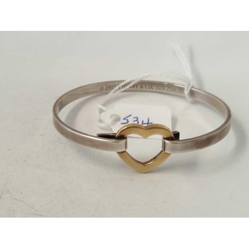 534 - A silver and gold heart bracelet marked 2023 TIFFANY and Co 925 and 750 25mm diameter 14.7 gms