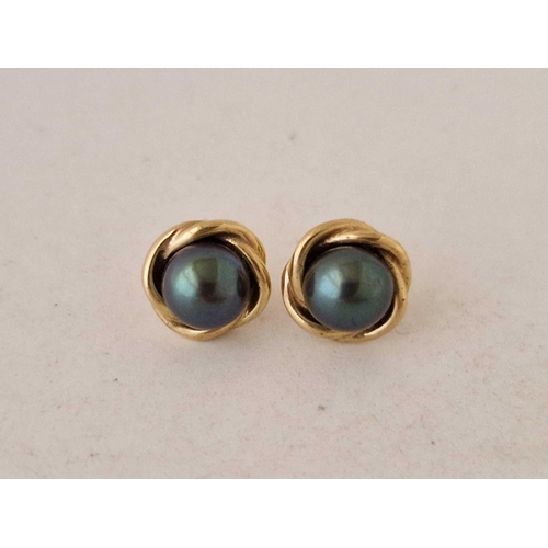 595 - A pair of black pearl ear studs 9ct 2.8 gms