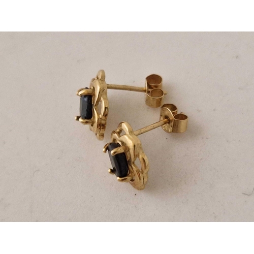 596 - A pair of 9ct ear studs