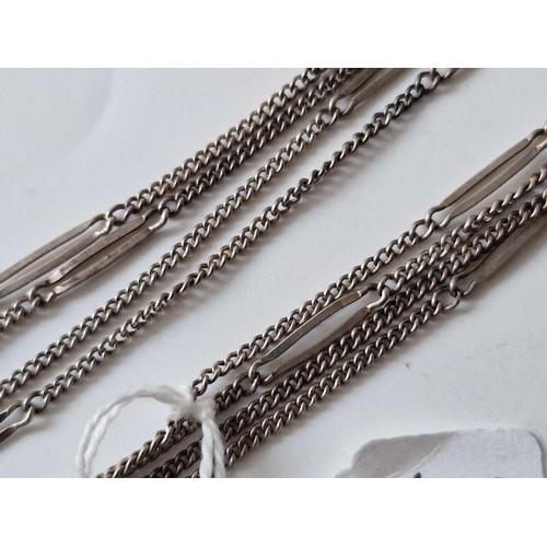 602 - A long silver guard chain 54 inch 14 gms