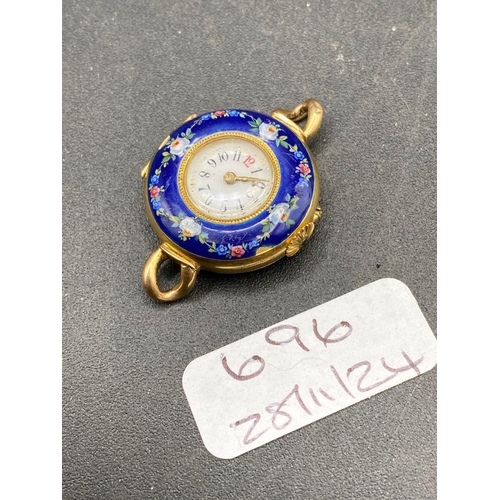 696 - A ladies enamel decorated wrist watch broken hinged 14ct gold