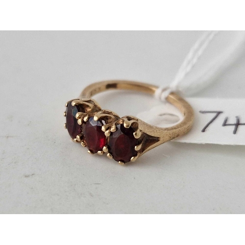 74 - A three stone garnet ring 9ct size J 2.5 gms