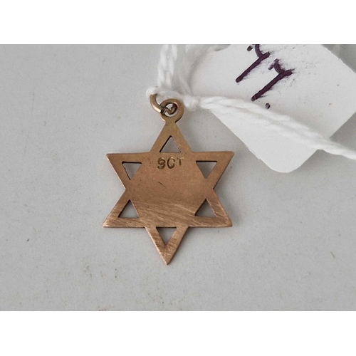 77 - A star of David charm 9ct