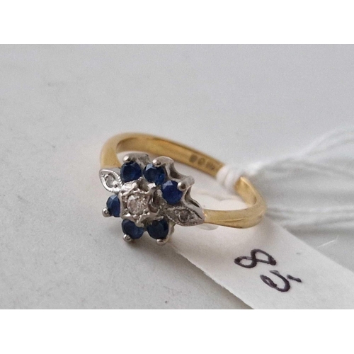 85 - A sapphire and diamond nine stone ring 18ct gold size J 3.4 gms