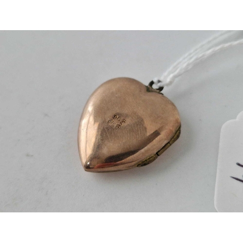 94 - A heart shaped back and front locket 3.6 gms